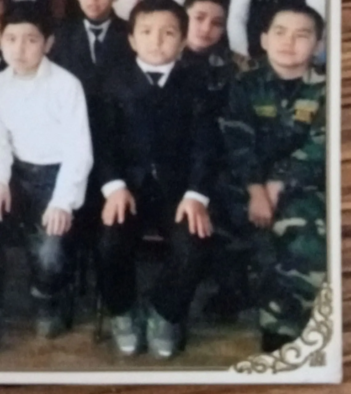 school photo with classmates, me in a camouflage uniform