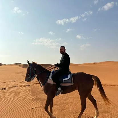 riding a horse in the desert